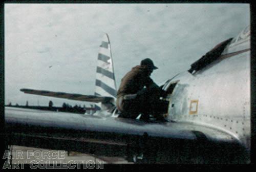 F-84 MECHANIC AT WORK NOT A PAINTING BUT A PHOTOGRAPH-SEE FILE CCAF